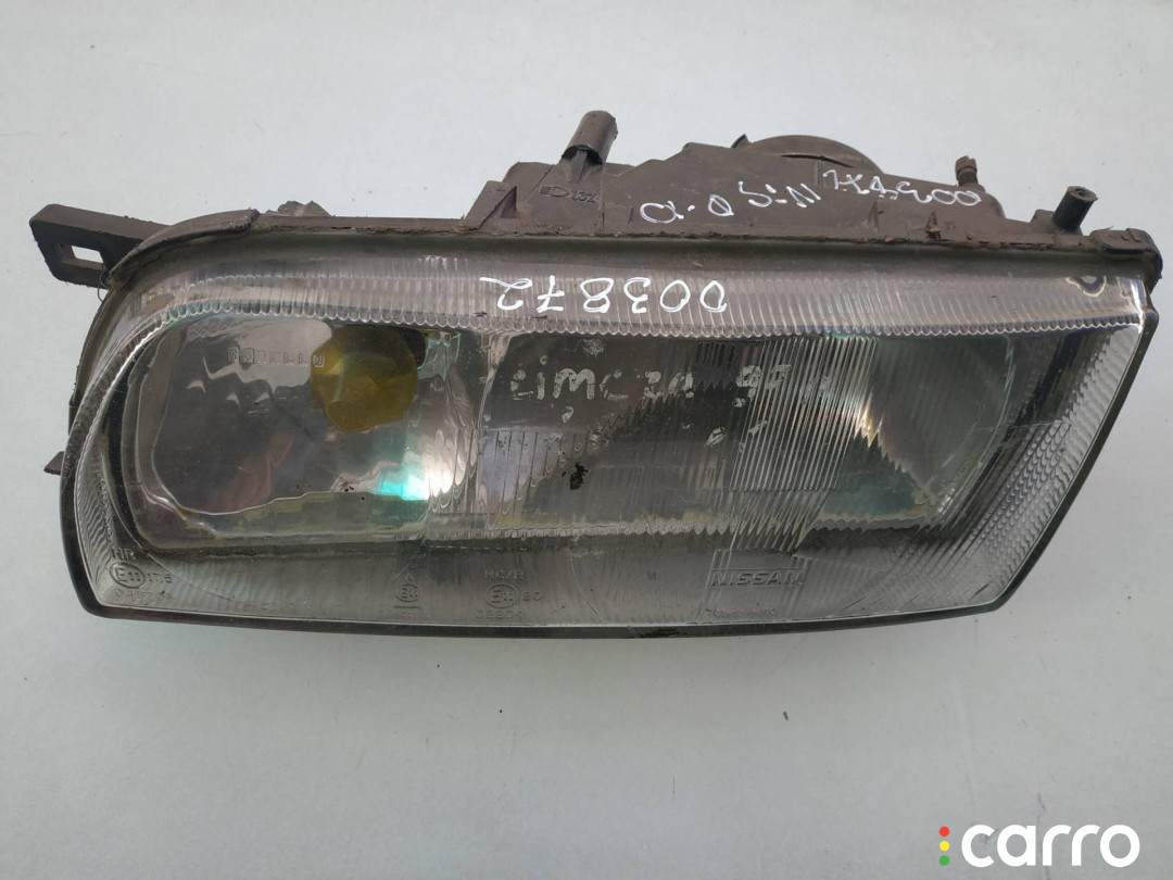 фара левая Nissan Primera P10 1994г. - фото №1